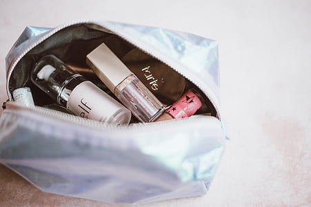 assorted-brand cosmetic bottles thumbnail