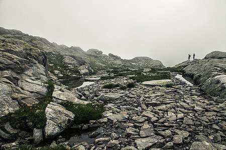 two persons standing on rock mountain thumbnail
