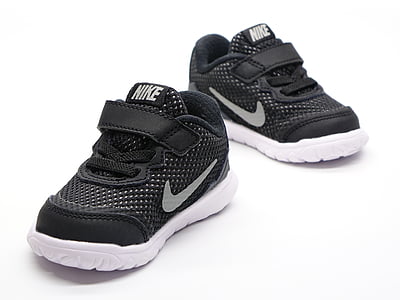 pair of toddler's black-and-white Nike sneaker on white surface thumbnail