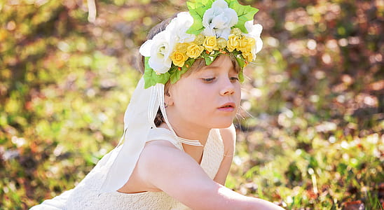 girl wearing white lace dress and flower headdress thumbnail
