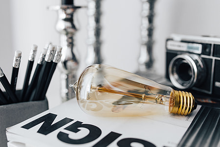 Pencils, magazines and an old lightbulb thumbnail