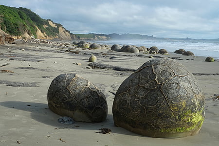 two gray rocks on shore thumbnail