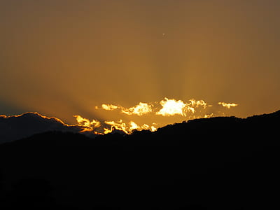 silhouette of mountain under sunrise thumbnail
