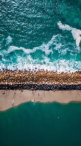 beach shore in middle of body of water thumbnail