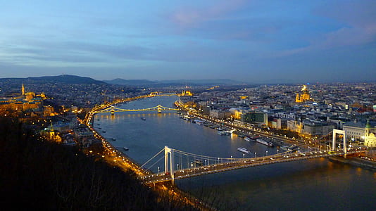 bridge over body of water under the blue sky thumbnail