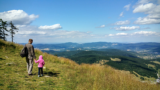 man and child on mountain hill at daytime thumbnail