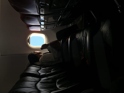 men watching on the plane window thumbnail