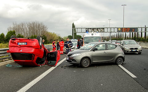 gray 5-door hatchback near red vehicle during daytime thumbnail