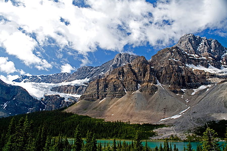 mountain with snow near lake thumbnail