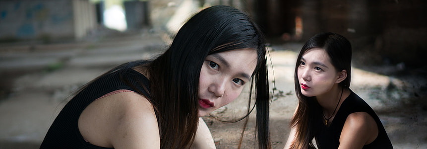 woman wearing black sleeveless shirt white taking picture thumbnail