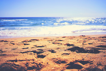 sand near seashore photography thumbnail