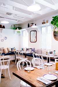 vacant white wooden seats and table inside room thumbnail