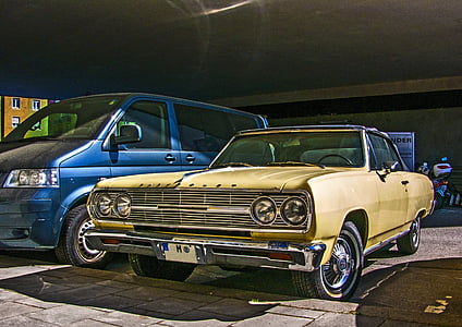 high-saturated photography of parked classic blue and brown cars thumbnail