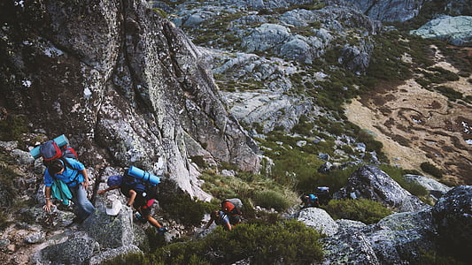 group people climbing rock mountain thumbnail