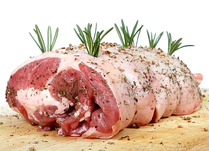 raw meat on brown wooden chopping board thumbnail