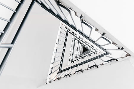 low-angle photography of gray building stairs thumbnail