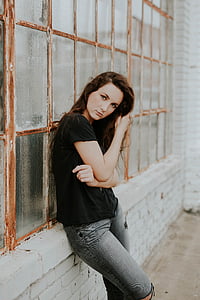 woman in black shirt against window thumbnail