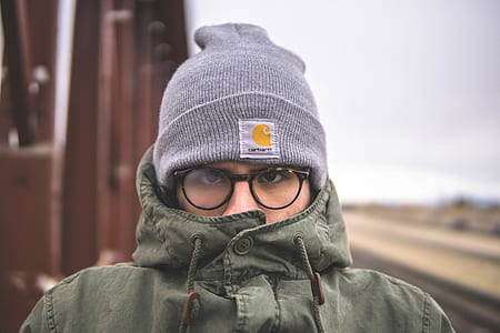 person in clear eyeglasses and green jacket thumbnail
