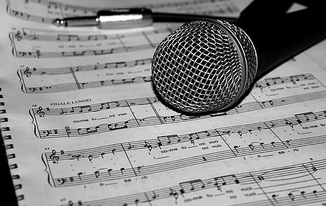gray and black microphone on music sheet thumbnail