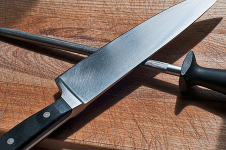 gray knife with black handle thumbnail