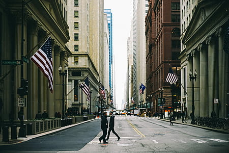 two person walking on street during daytime thumbnail
