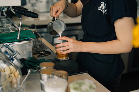 person pouring milk into glass thumbnail
