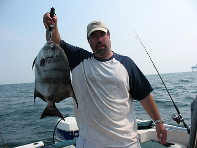 Angler with an Atlantic Spadefish thumbnail