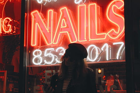 woman standing near glass LED wall thumbnail