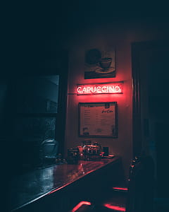 Capuccino LED signage near table during night time thumbnail
