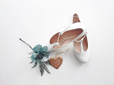 white leather pumps and blue artificial flower thumbnail