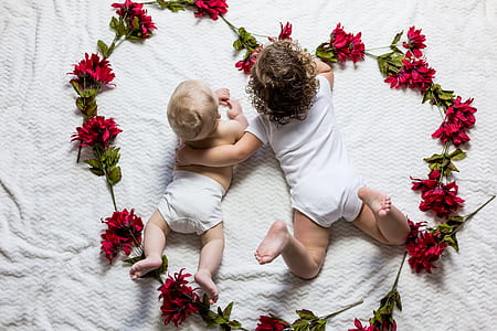 two babies in white dresses thumbnail