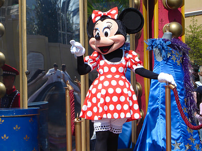 Minnie Mouse mascot standing near glass door thumbnail