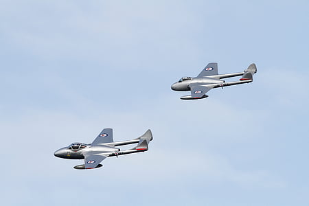 two gray airplanes flying thumbnail