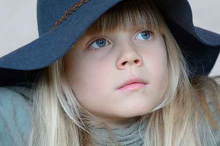 close up photo of girl wearing sun hat thumbnail