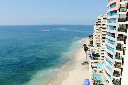 high angle photography of buildings facing shore thumbnail