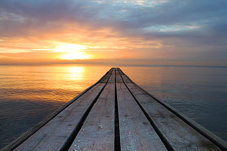 photography of wooden dock during sunset thumbnail