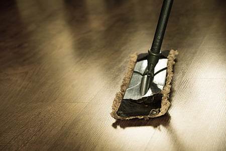 black and gray mop on brown floor thumbnail