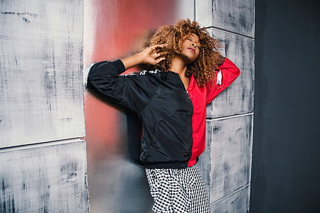 Woman in Red and Black Bomber Jacket thumbnail