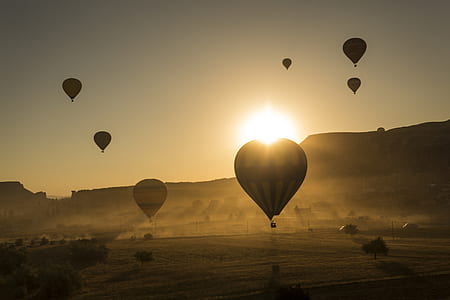 flying hot air balloons during golden hour thumbnail