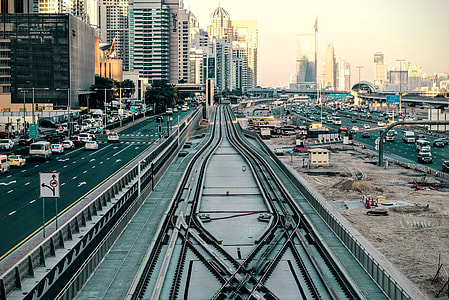 gray metal railways in between road thumbnail