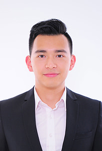portrait photo of man wearing black notched lapel suit jacket and white dress shirt thumbnail