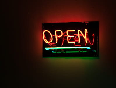 orange OPEN neon sign on wall thumbnail