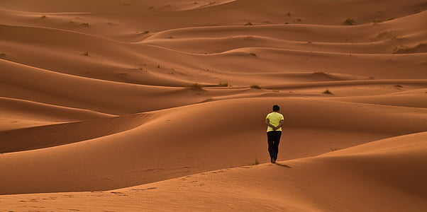 man standing on desert thumbnail