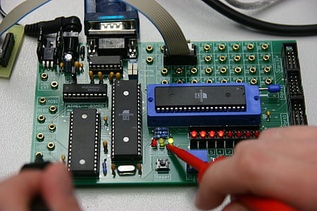 person holding soldering iron thumbnail