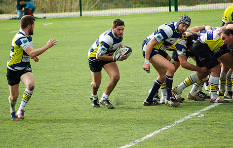 men playing football on field thumbnail