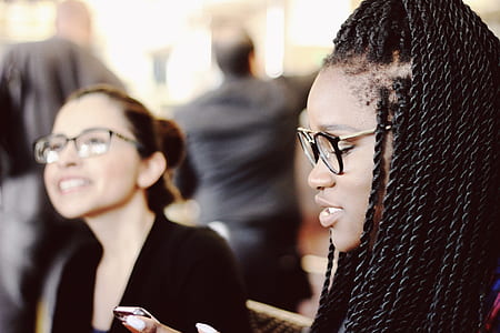 braided hair woman in black framed eyeglasses thumbnail