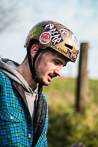 man wearing brown helmet and gray hoodie thumbnail