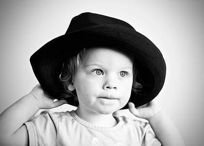 grayscale photo of a girl wearing hat thumbnail