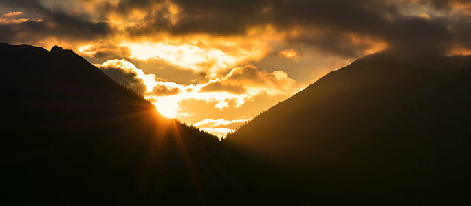 silhouette of mountains during golden hour thumbnail