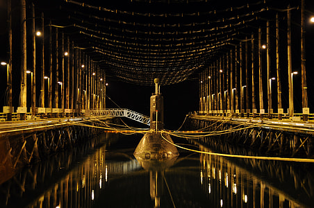 water mirror photography of brown tower thumbnail